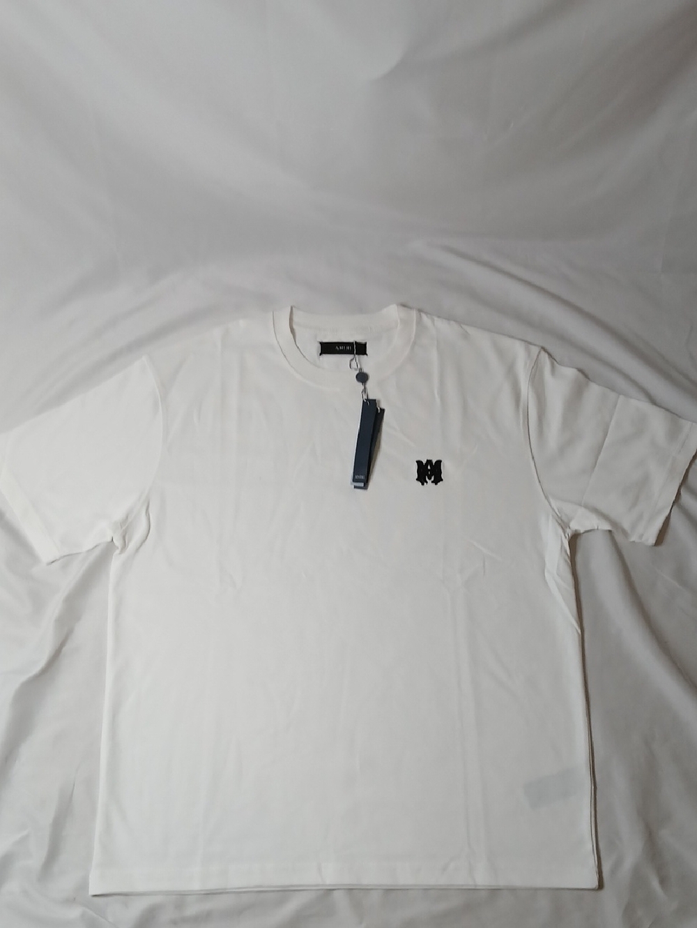 AMIRI White Short Sleeve Crewneck Tee with Black Logo Patch
